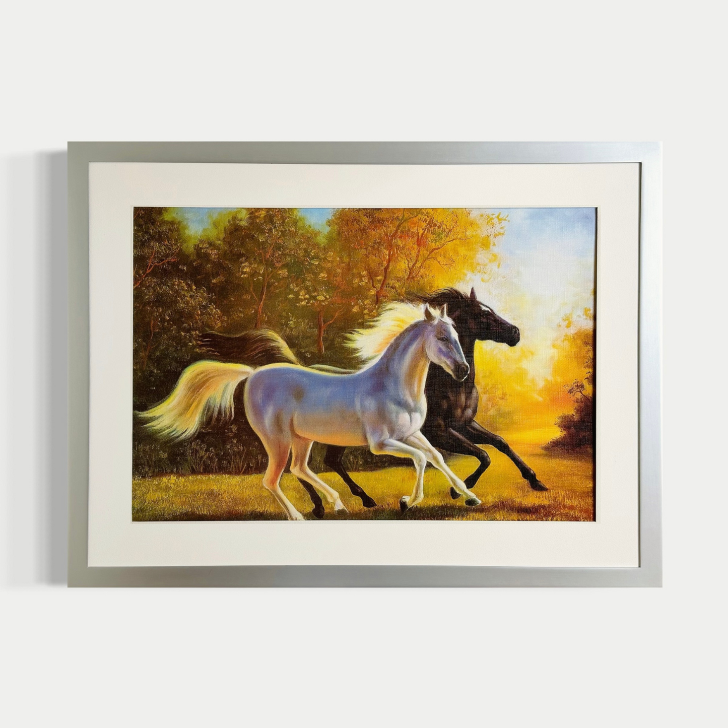 Caballos galopando hacia el sol